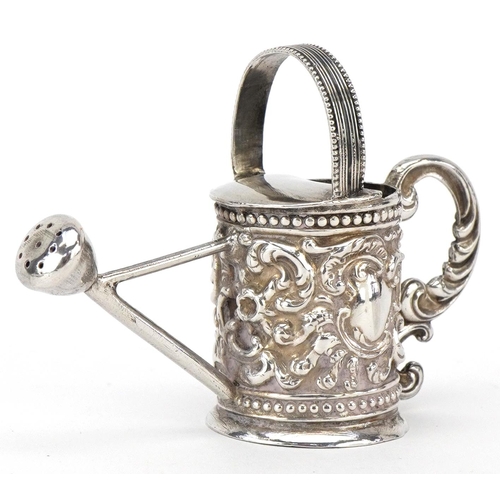 579 - Martin Sugar, a Victorian silver doll's house watering can, London 1893, 6.5cm in length, 22.3g.