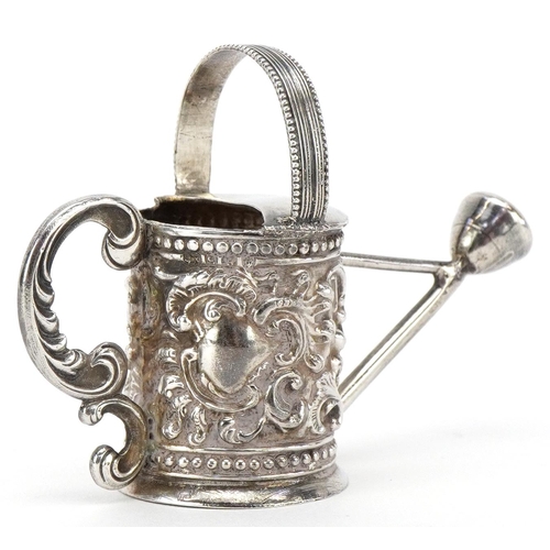 579 - Martin Sugar, a Victorian silver doll's house watering can, London 1893, 6.5cm in length, 22.3g.