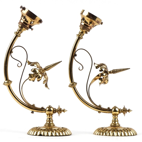 357 - A pair of Gothic Revival brass wall lights, 33cm in length.