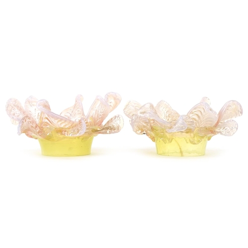 259 - A pair of Vaseline and uranium glass floral light shades, approximately 15cm in diameter, the fittin... 