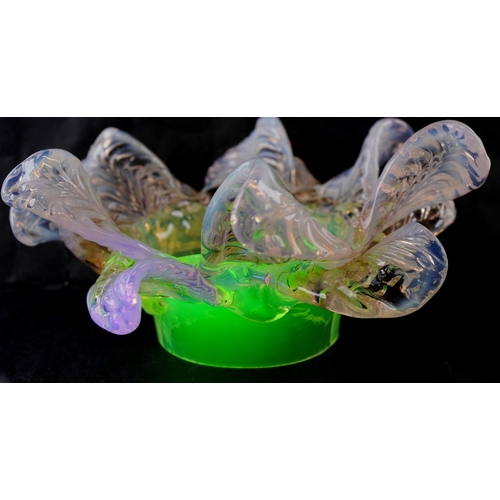 259 - A pair of Vaseline and uranium glass floral light shades, approximately 15cm in diameter, the fittin... 