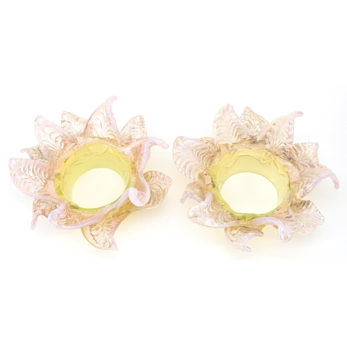 259 - A pair of Vaseline and uranium glass floral light shades, approximately 15cm in diameter, the fittin... 