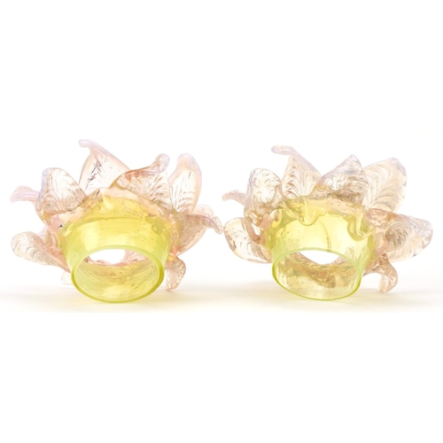 259 - A pair of Vaseline and uranium glass floral light shades, approximately 15cm in diameter, the fittin... 