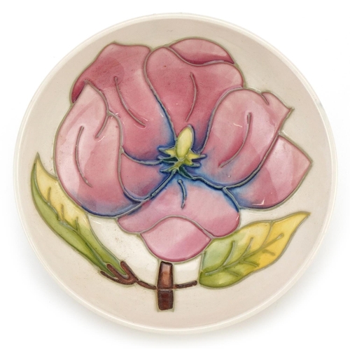 147A - A Moorcroft Pink Magnolia pattern bowl numbered 75194 to the base, 12cm in diameter.