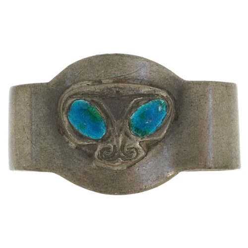 228 - An Arts & Crafts pewter and enamel napkin ring numbered 0919, possibly by Archibald Knox for Liberty... 