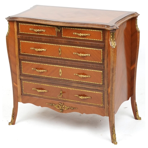 2137 - A 20th century Louis XV style kingwood and gilt metal mounted chest of drawers opens up to a cocktai... 