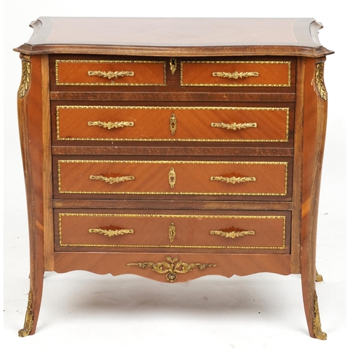 2137 - A 20th century Louis XV style kingwood and gilt metal mounted chest of drawers opens up to a cocktai... 