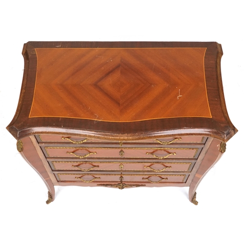 2137 - A 20th century Louis XV style kingwood and gilt metal mounted chest of drawers opens up to a cocktai... 