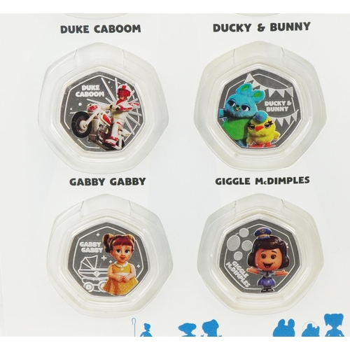 1295 - A Disney Pixar Toy Story 4 Official Coin Collector's pack containing eight fifty pence piece shaped ... 