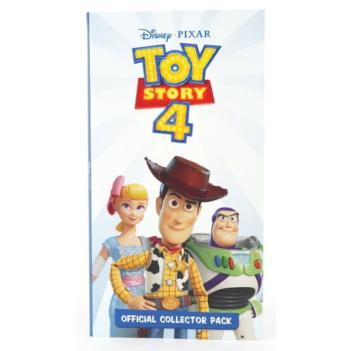 1295 - A Disney Pixar Toy Story 4 Official Coin Collector's pack containing eight fifty pence piece shaped ... 