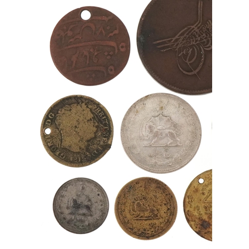 1251 - 19th century and later coins, some silver, to include two silver Tibetan Tangka, an Iraqi 1938 silve... 