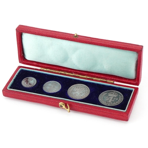 A Victorian 1889 silver Maundy coin set in uncirculated condition housed in a red box.