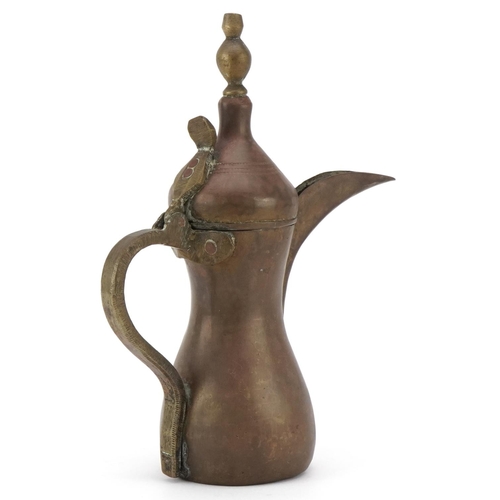 2564 - A Middle Eastern brass dallah coffee pot, early/mid 20th century, 28cm high.