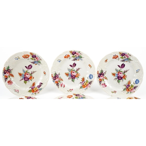 268 - A matched set of Royal Crown Derby plates, each with hand painted floral decoration, 24cm in diamete... 