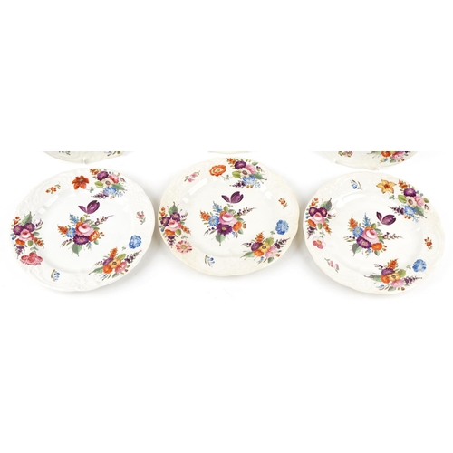 268 - A matched set of Royal Crown Derby plates, each with hand painted floral decoration, 24cm in diamete... 