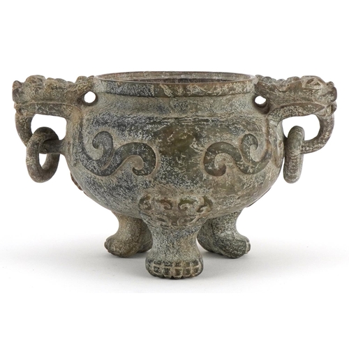 156 - A Chinese reconstituted hardstone tripod censer with dragon mask handles, decorated in relief, 9cm H... 