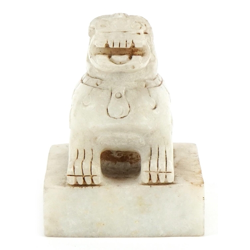 254 - A Chinese carved alabaster desk seal, 20th century, in the form of a Foo dog, four character mark to... 