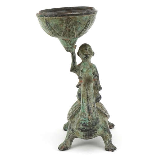 155 - A Chinese verdigris metal figural incense burner, 20th century, modelled as a boy on the back of a d... 