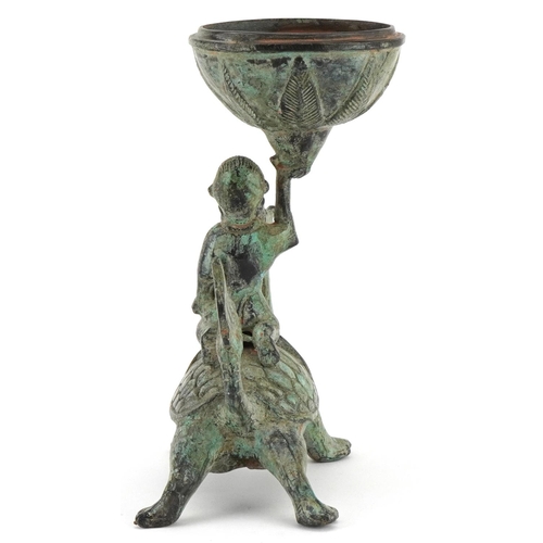 155 - A Chinese verdigris metal figural incense burner, 20th century, modelled as a boy on the back of a d... 