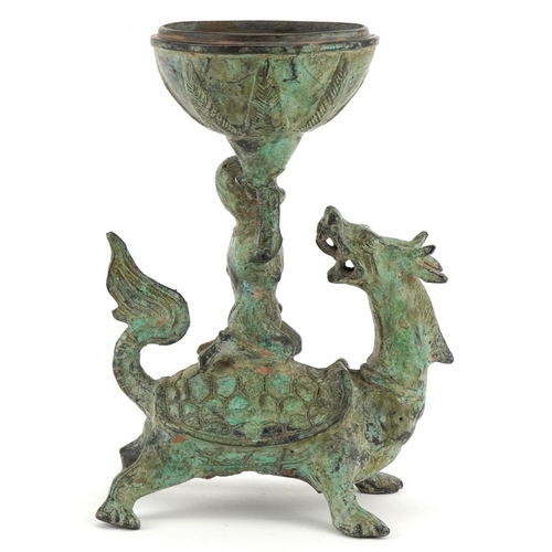 155 - A Chinese verdigris metal figural incense burner, 20th century, modelled as a boy on the back of a d... 