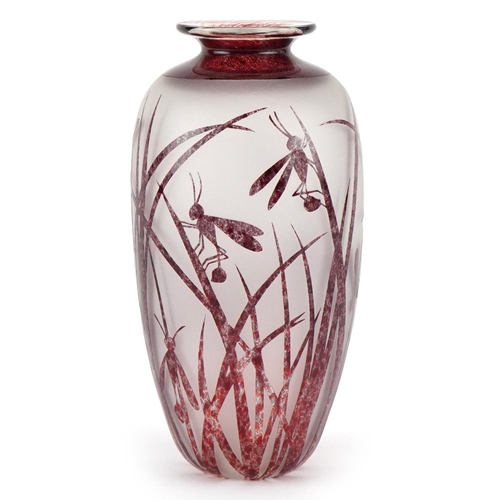 2560 - An Art Deco style red cameo acid etched glass vase decorated with insects amongst grass, with overtu... 