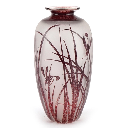 2560 - An Art Deco style red cameo acid etched glass vase decorated with insects amongst grass, with overtu... 