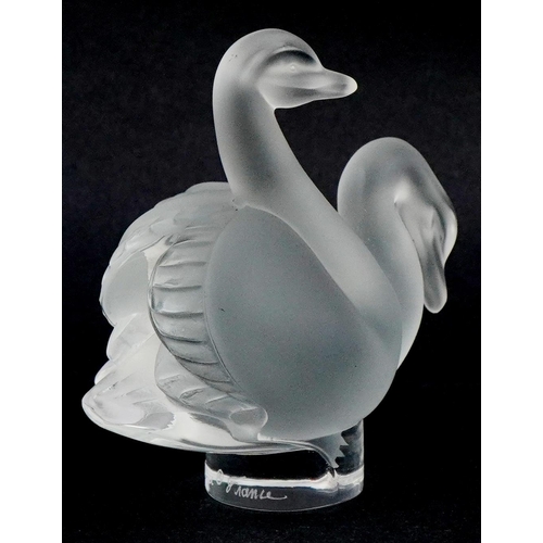 180 - Lalique, a frosted glass study of two swans, etched Lalique France, 7.5cm high, with box.