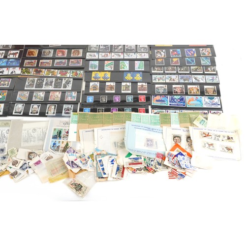 1332 - A quantity of 19th century and later British and world stamps to include sixty three British present... 