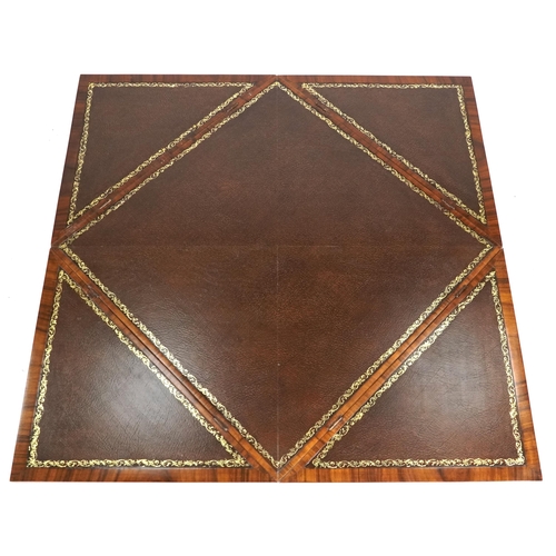 2134 - A late 20th century walnut envelope card table with cross banded decoration, the rotating top raised... 