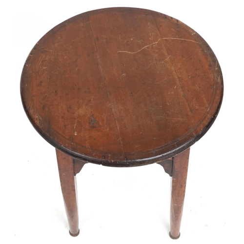 2131 - An early 20th century Arts & Crafts oak and walnut circular lamp table raised on tapering legs unite... 