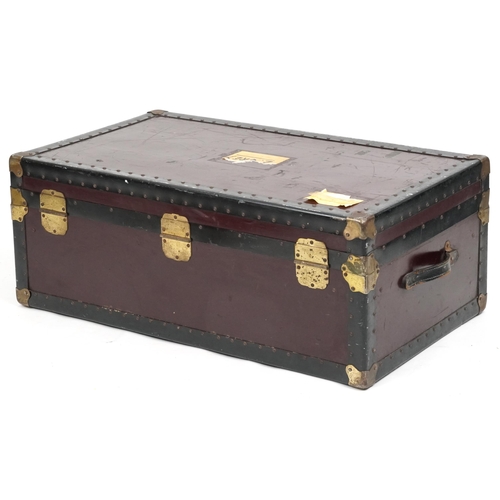 2032 - An early 20th century brass bound travelling trunk, the hinged lid revealing a removeable tray, 37cm... 