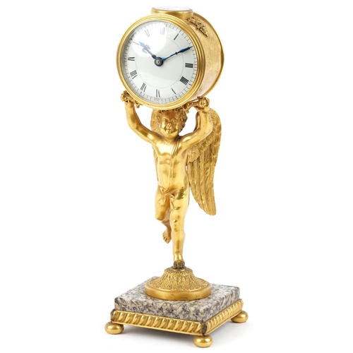 An early 20th century French gilt bronze mantle clock, the circular white enamelled dial having Roman numerals and supported on by a winged cherub, raised on a square grey marble plinth base and gilt metal feet, 34cm H x 12cm W x 12cm D.