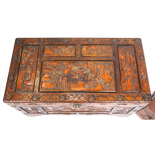 2135 - A Chinese camphor trunk with carved decoration, 20th century, 58cm H x 101cm W x 53cm D, together wi... 