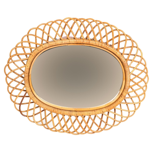 2138 - A mid 20th century wicker oval wall mirror, 66cm x 78cm.