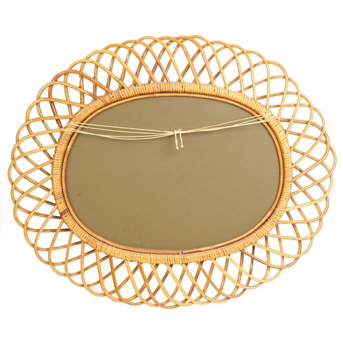 2138 - A mid 20th century wicker oval wall mirror, 66cm x 78cm.