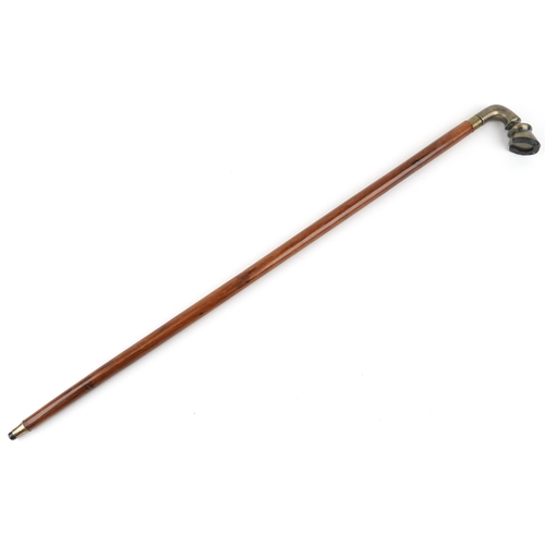 405 - A hardwood walking stick with brass handle in the form of a horse hoof, 92cm in length.