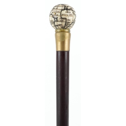 408 - A hardwood walking stick with carved bone handle in the form of a globe opening to reveal a compass,... 