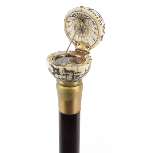 408 - A hardwood walking stick with carved bone handle in the form of a globe opening to reveal a compass,... 