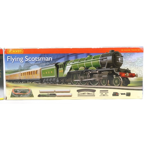 1083 - Two Hornby OO gauge model railway sets with boxes comprising Flying Scotsman R1072 and GWR Western P... 