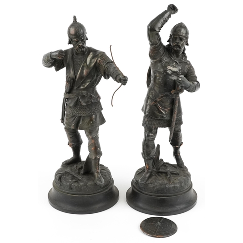 264 - After Emile Bruchon, a pair of bronzed spelter Viking figures, the largest 50cm high.