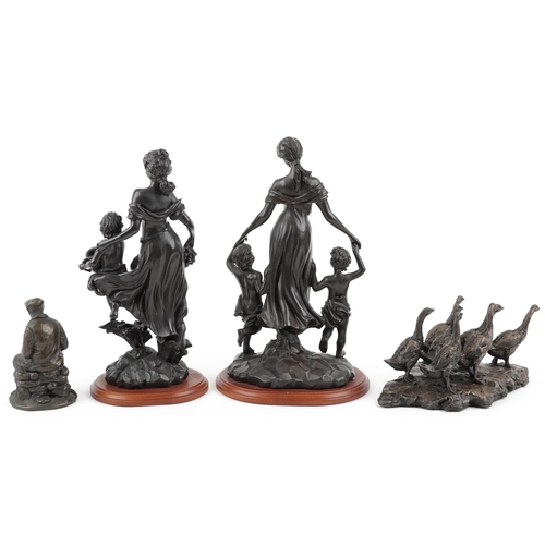 483 - Four decorative bronzed figures including mothers with children and a group of geese, the largest 34... 