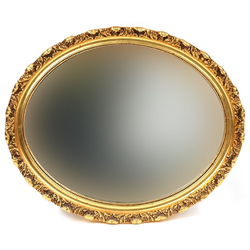 2105 - A modern gilt framed oval wall mirror, 48cm x 58cm.