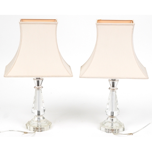 2150 - A pair of perspex table lamps with cloth shades, H-59cm.