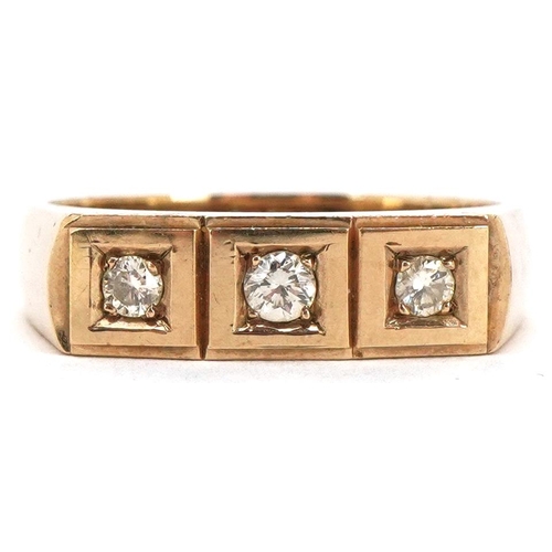 3077 - A 9ct gold diamond three stone ring, the central diamond approximately 2.55mm in diameter, size T, 5... 