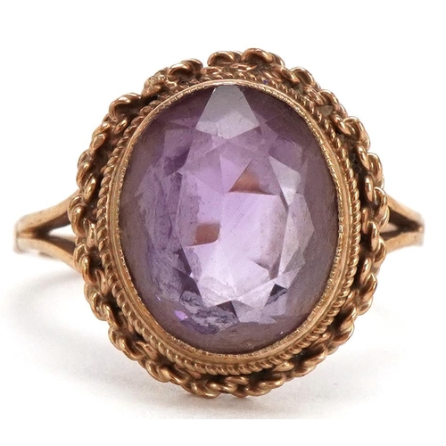 3049 - A 9ct gold amethyst solitaire ring, size N, 3.8g.