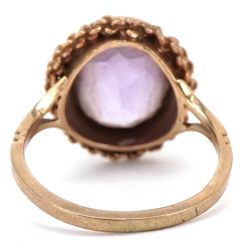 3049 - A 9ct gold amethyst solitaire ring, size N, 3.8g.