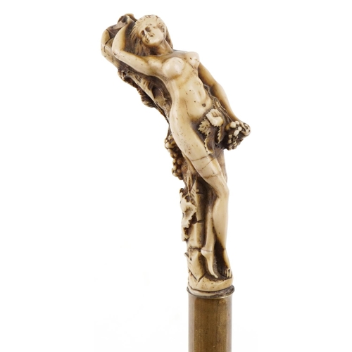 404 - A 19th century bamboo swordstick with moulded bone design handle in the form of a nude female with b... 