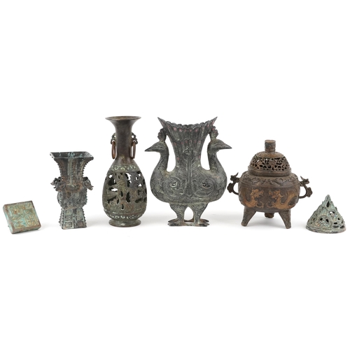 466 - A small group of Chinese bronze items, 20th century, including a tripod censer, a desk seal, a squar... 