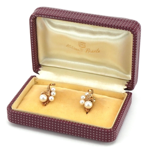 3037 - A pair of Japanese 14ct gold Mikimoto pearl screw back earrings, 1.8cm high, total 4.8g, housed in a... 