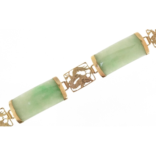 3034 - A Chinese 14ct gold and green jade panel bracelet, 17cm in length, 15.5g.